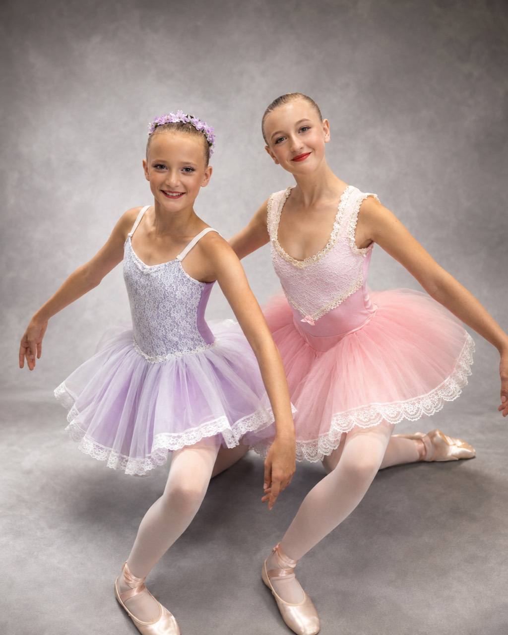 Two young ballet dancers in recital dresses