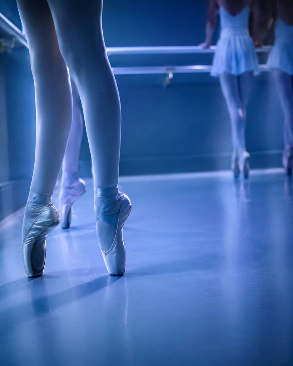 Ballet dancers on pointe at the barre
